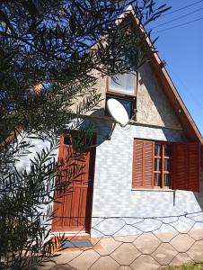 a house with a window and a door at De Férias na Fronteira in Xuí +9 photos