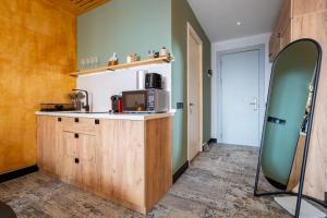 a kitchen with a counter with a microwave on it at New Gudauri Atrium 218 in Gudauri