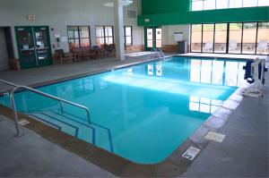 a large swimming pool in a building at Isle Casino Hotel Bettendorf - A Caesars Rewards Destination in Bettendorf