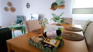 a bottle of wine sitting on top of a table at BENAMAR HOUSE in Quarteira