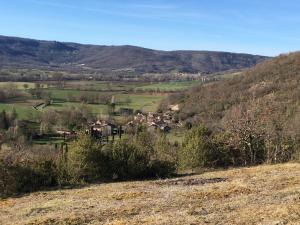 a view of a valley with houses in a field at Truffières de Boitresor in Labarthe-Bleys