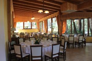 a large room with a table and chairs in it at Hotel Villa Aricia in Ariccia