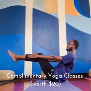 a man sitting on the floor in a yoga pose at The Nest - Complimentary Massage Included in Kigali