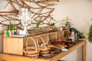 a counter with baskets of food and a mixer at The Nest - Complimentary Massage Included in Kigali