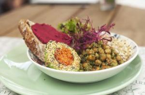 a bowl of food on a plate on a table at La Liebre bed and breakfast in El Retiro +21 photos