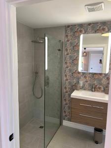 a bathroom with a shower and a sink at The Marmalade Motel in Port Dufferin +61 photos
