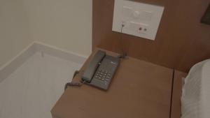 a phone is sitting on top of a box at Hotel Gupta Garden in Gaya