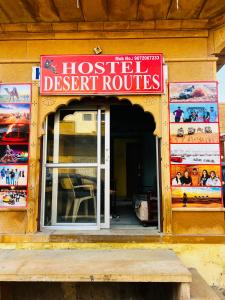 a hostel restaurant with a sign in front of it at Hostel Desert Routes in Jaisalmer