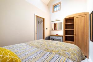 a small bedroom with a bed and a cabinet at 1 Bed in Trimingham oc-h29803 in Trimingham