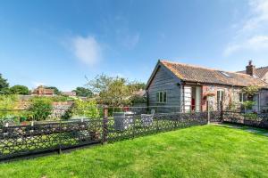 a house with a fence in front of a yard at 1 Bed in Trimingham oc-h29803 in Trimingham