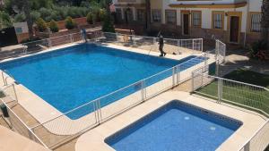 an overhead view of a large swimming pool at Casa Rural las Rosas de Benaojan in Benaoján
