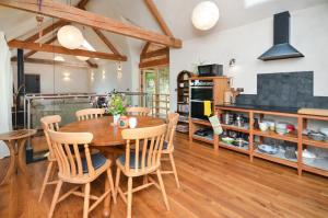 a kitchen and dining room with a wooden table and chairs at 3 Bed in Dartington oc-b30033 in Darlington +23 photos