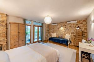 a bedroom with a bed and a brick wall at 3 Bed in Dartington oc-b30033 in Darlington
