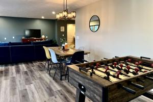 a living room with a large pool table at Lakefront Suite Dock, No-Wake Cove & Firepit in Marion
