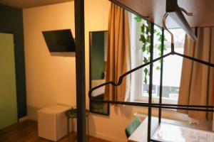 a lamp in a room with a window at Airport Hotel Jägerhof Weeze in Weeze +43 photos