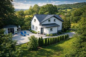 an aerial view of a white house with a yard at Dablin 9 - Dom w górach z gorącą balią, blisko szlaków i wyciągów in Korbielów