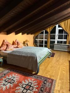 a bedroom with a bed and a large tent at Gästeresidenz - Hotel - Ruthellen's Home in Planegg