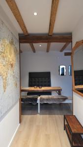 a living room with a couch and a table at Hof Busen Malibu in Mönchengladbach