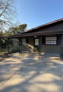 a building with a large driveway in front of it at Relaxing 1BR Apartment in Ormond Beach Large Patio in Ormond Beach