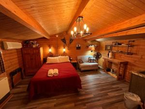 a bedroom with a bed in a wooden room at The Timberjack in Hayward