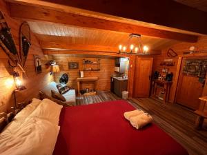 a bedroom with a large bed in a cabin at The Timberjack in Hayward