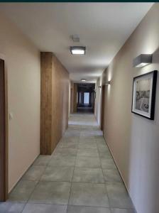 an empty hallway in an office building at Bee happy apartament Kępno in Kępno