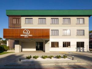 a large white building with a sign on it at Ibirama Vale Hotel in Ibirama