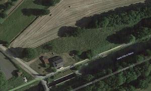 an aerial view of a farm with a building in a field at Gîte du Gacet in Trévérien