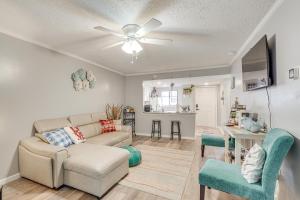 a living room with a couch and a table at 7 Mi to Downtown Fun! Spacious Augusta Condo in Augusta