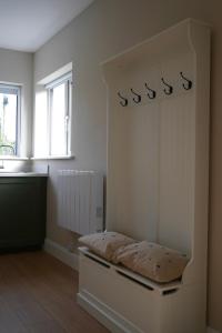 a room with a bed in a room with a window at McGinns Cottage in Kilcormac