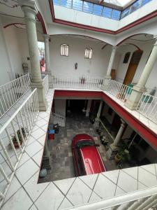 an overhead view of a red car in a building at Hotel san ignacio in Oaxaca City