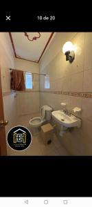 a bathroom with a toilet and a sink at Hotel san ignacio in Oaxaca City