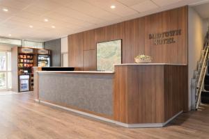 a lobby with a reception desk and a welcome sign at The Midtown Hotel MOD Collection by Sonesta in Boston