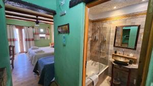 a bathroom with a bed and a tub in a room at La Posada del Rio in Tilcara +99 photos