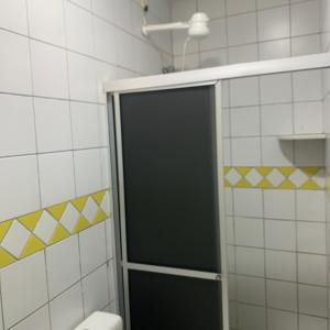 a shower with a glass door in a bathroom at Pousada Mayer in Paulo Afonso +5 photos
