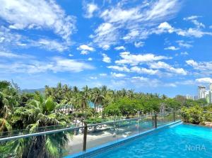 a view of the pool from the balcony at AHoa StarCity with Seaview in Nha Trang