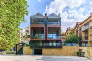 an exterior view of a building at Stunning 4 Bedroom Duplex in Kfardebian