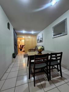 a dining room with a table and two chairs at Downtown Suite Wifi in Morelia