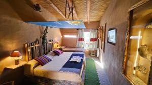 a bedroom with a bed in a room at La Posada del Rio in Tilcara