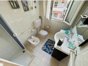 a bathroom with a sink and a toilet and a shower at Casa vacanza "Orchidea" in Marzamemi