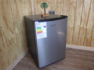 a refrigerator with a tree on top of it at Cabaña Pehuen in San José de Maipo