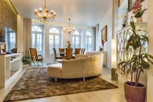 a living room with a couch and a table at Cidadela do Viriato Deluxe in Viseu