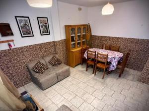 a living room with a table and a couch at Ocean Blue in Huanchaco +12 photos