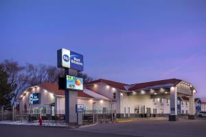 a gas station with a sign in front of it at Best Western Montrose Inn in Montrose