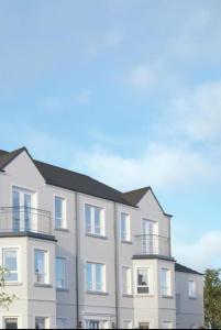 an apartment building with balconies on top of it at The Mourne Nest in Newcastle