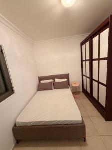 a bedroom with a bed in a room at נוף ראשון לים in Ashkelon