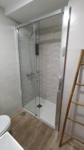 a shower stall in a bathroom with a toilet at Los Naranjos de Marbella in Marbella +2 photos