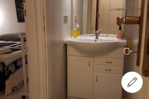 a bathroom with a sink and a mirror at Villa Celeste in Torre delle Stelle