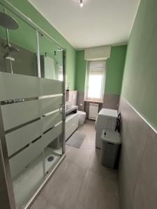 a bathroom with a glass shower and a toilet at Ladybug in Canale +20 photos