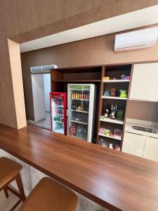 a refridgerator in a kitchen with a counter top at HOTEL PLAZA PONTES e LACERDA in Pontes e Lacerda